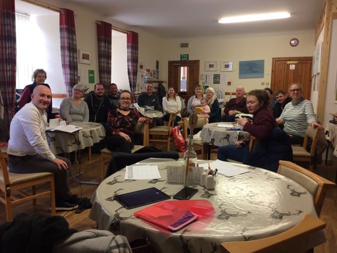 Group of people in a community meeting about BSL Scotland Act 2015.