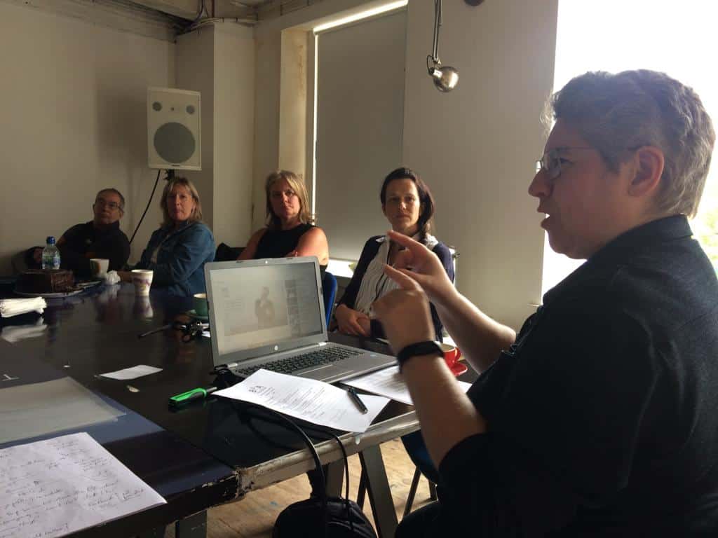 Group of people in a meeting discussing BSL Scotland Act 2015.