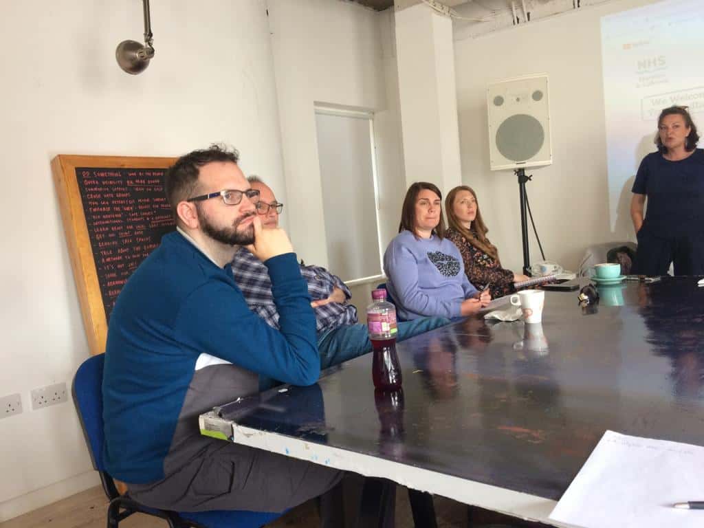 Group of people attending a BSL Act 2015 awareness session in Scotland.