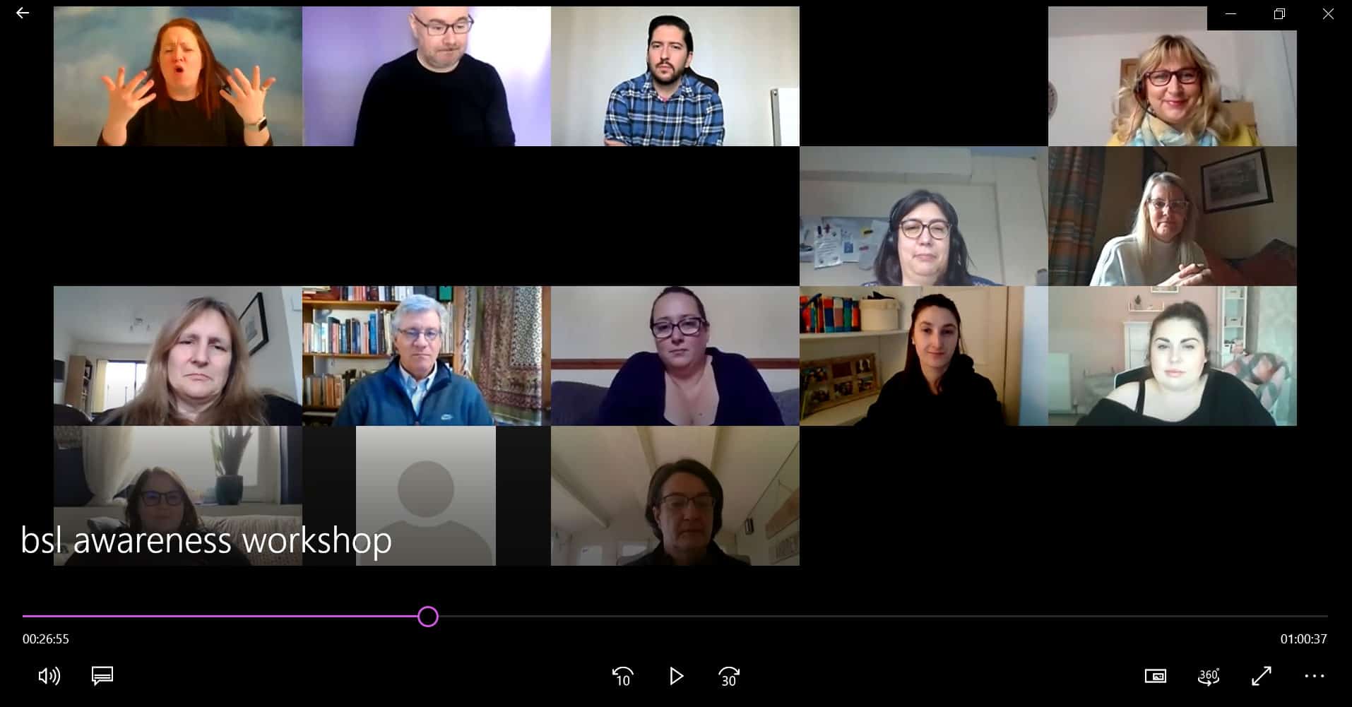 Group of people participating in a BSL awareness workshop, discussing the BSL (Scotland) Act 2015.