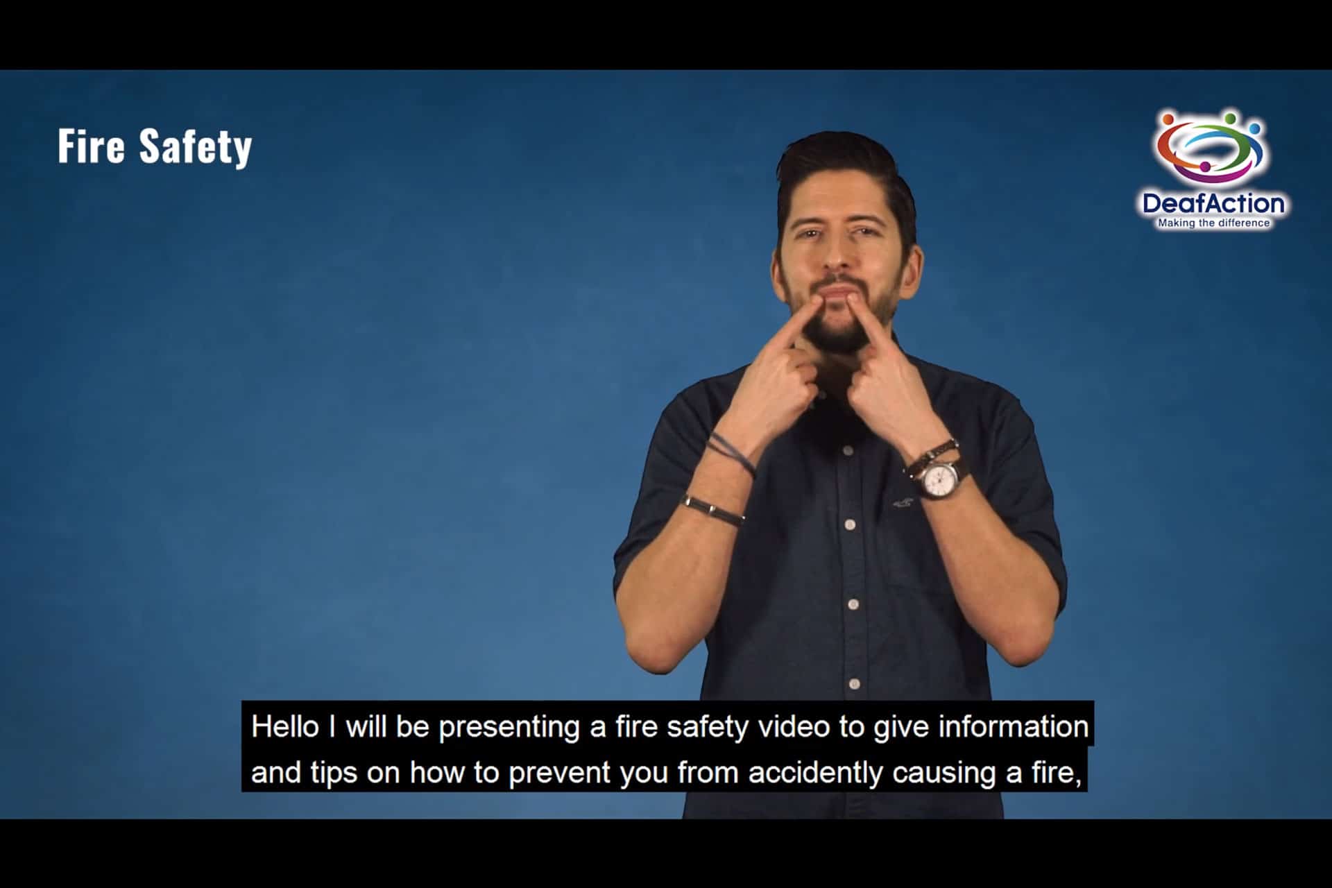 DeafAction presenter giving fire safety tips in sign language.