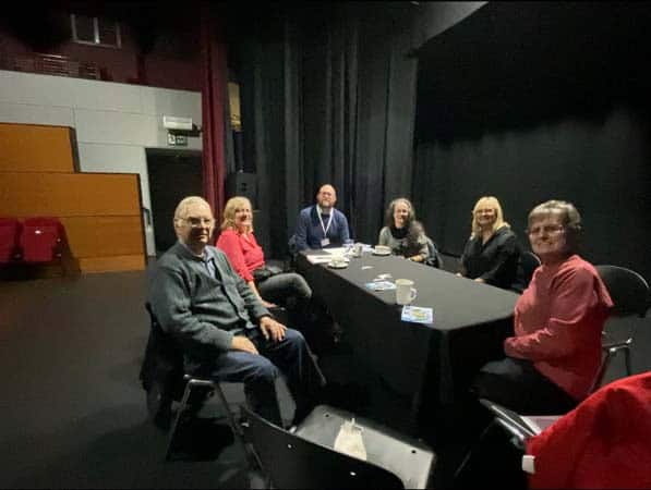 Group of people discussing BSL Act 2015 in a meeting room.