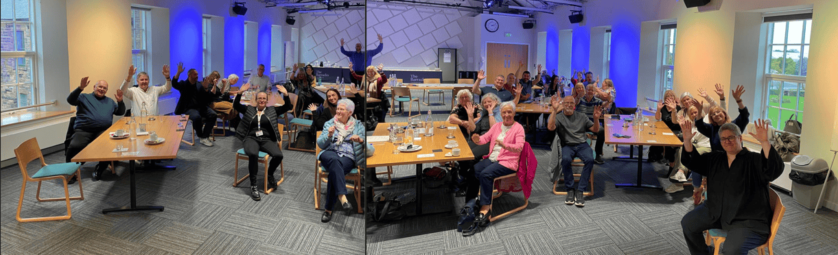 Community event celebrating BSL Scotland Act 2015 with sign language performers.