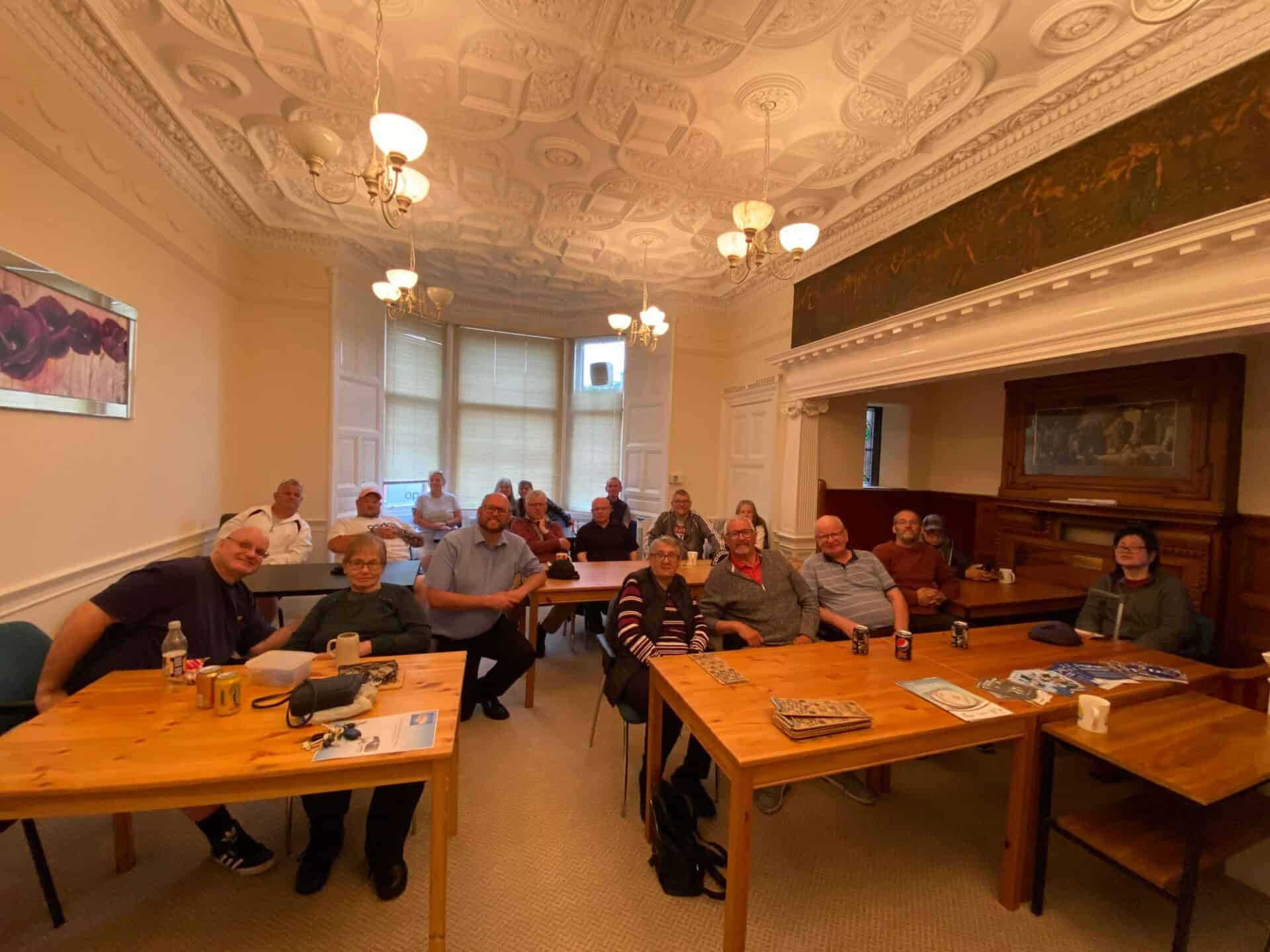 Group of people attending a meeting about the BSL (Scotland) Act 2015.