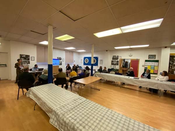 Community meeting on the BSL (Scotland) Act 2015 in a community hall.