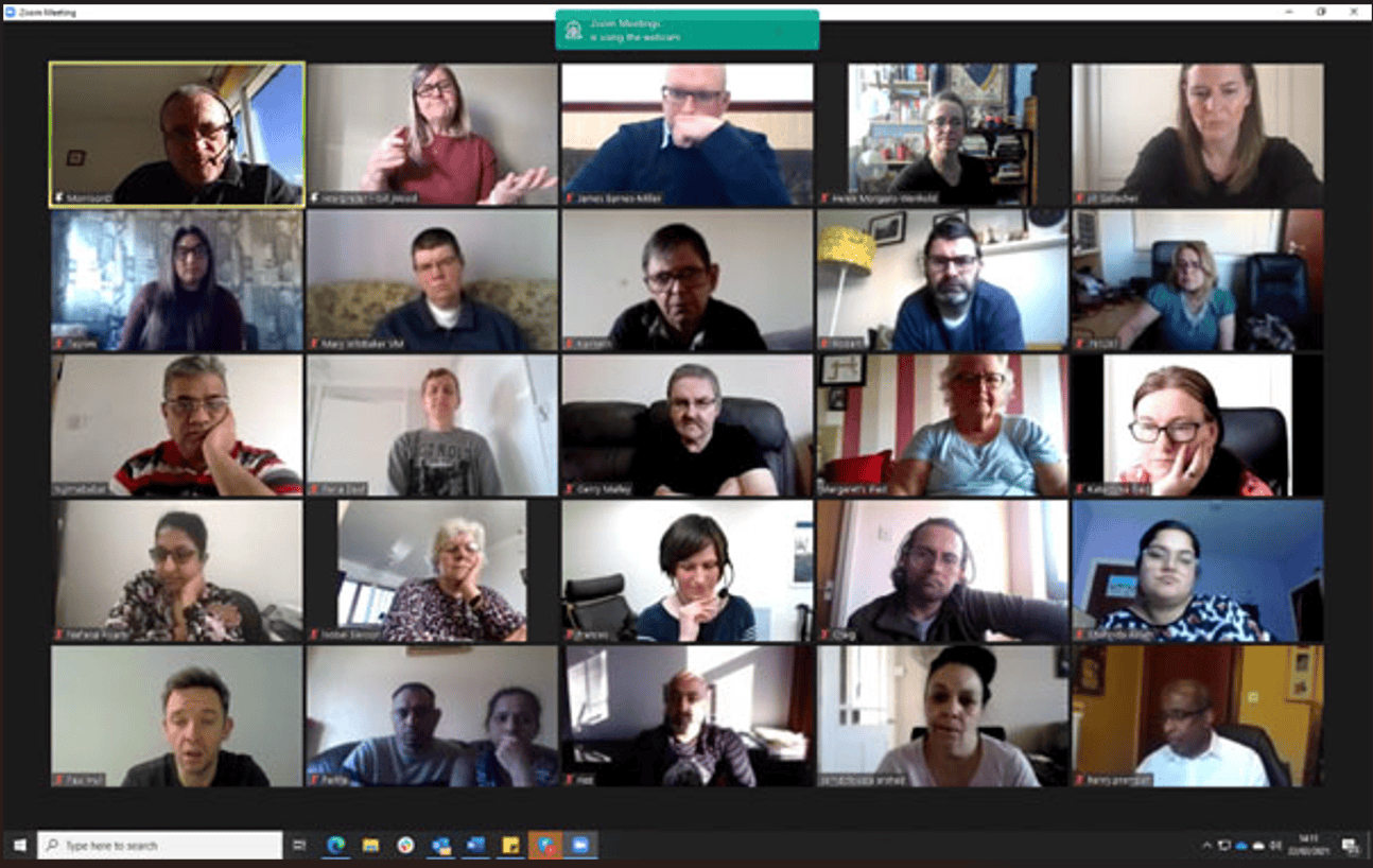 Group of diverse people in a virtual meeting discussing BSL (Scotland) Act 2015.